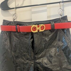 Red Belt with Gold Buckle on Black Pants